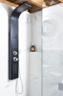 a shower with a glass door in a bathroom at Casa Pietra in Rome