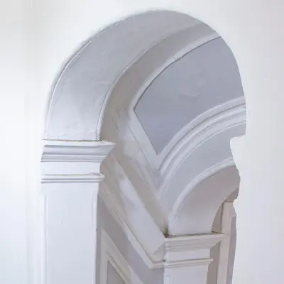 an archway on a building with a white wall at Casa Pietra in Rome