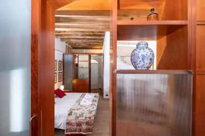 a room with a bed and a vase on a shelf at Campo de' Fiori Cozy Nest in Rome