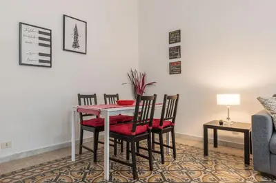 a dining room with a table and chairs at GuestHost - Borgo Pio Elegant Apartment! in Rome
