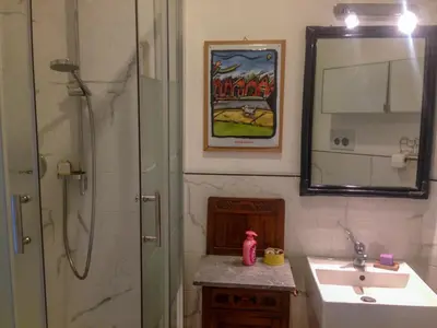 a bathroom with a shower and a sink and a mirror at LUMINOSA VISTA PIRAMIDE in Rome