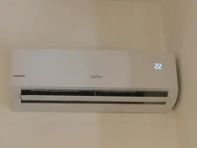 a white air conditioner is hanging on a wall at Appartamento vicino Stazione Termini e Colosseo in Rome