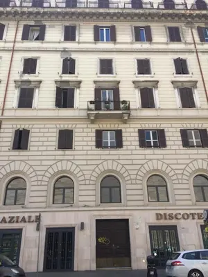 a large white building with many windows at Appartamento vicino Stazione Termini e Colosseo in Rome