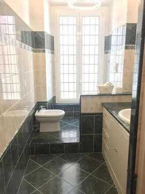 a bathroom with a toilet and a sink at Appartamento vicino Stazione Termini e Colosseo in Rome