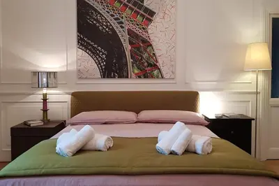 a bedroom with a bed with two pillows on it at A casa di Juno 
