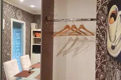 a room with a sliding door with a table and chairs at A casa di Juno 