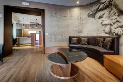 a living room with a couch and a table at Rome Art Hotel - Gruppo Trevi Hotels in Rome