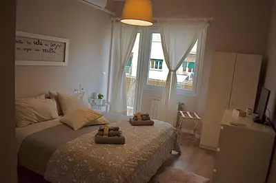 a bedroom with a bed with two towels on it at Domus Claudia in Rome