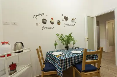 a dining room table with a blue and white table cloth at San Peter Dill House in Rome