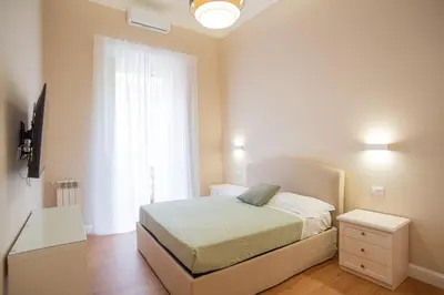 a small bedroom with a bed and a window at SWEET DREAM CAVOUR in Rome