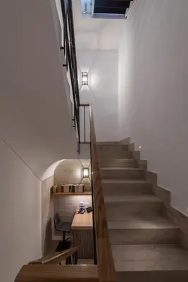 a staircase with a chair and a desk in a room at Laurina 33 in Rome