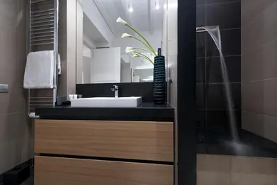 a bathroom with a sink and a mirror at Laurina 33 in Rome