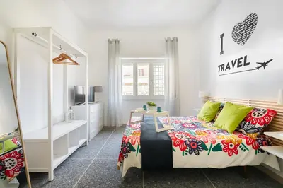 a bedroom with a bed and a tv at Stars Luxury Apartments 1 in Rome