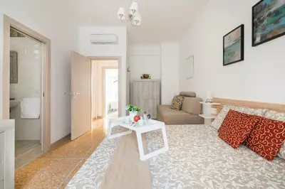 a living room with a couch and a table at Stars Luxury Apartments 1 in Rome