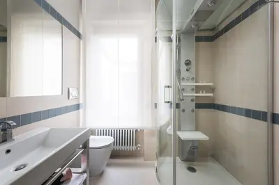 a bathroom with a shower and a toilet and a sink at Idyllia - Penthouse in Navona Area in Rome