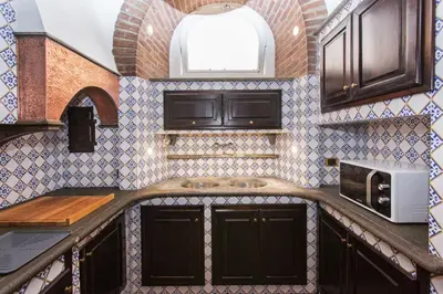 a kitchen with a sink and a microwave at spacious apartment in the centre of Rome in Rome
