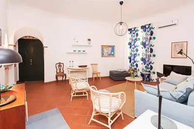a living room with a couch and a table at spacious apartment in the centre of Rome in Rome