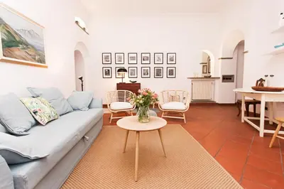 a living room with a couch and a table at spacious apartment in the centre of Rome in Rome