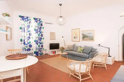 a living room with a couch and a table at spacious apartment in the centre of Rome in Rome