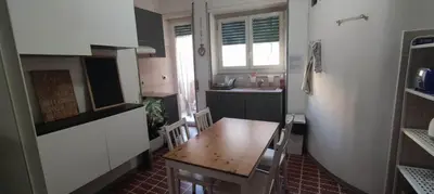 a bedroom with a bed and a chandelier at Holiday Max in Rome