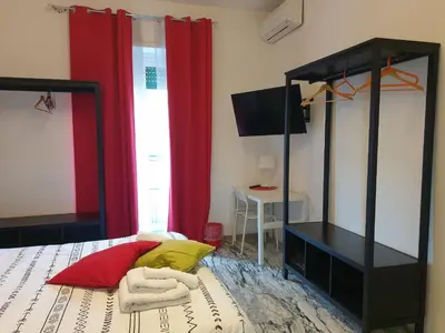 two beds sitting next to each other in a room at Holiday Max in Rome