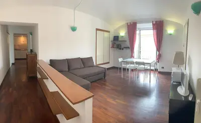 a living room with a couch and a table at Colosseo Boutique Apartment in Rome