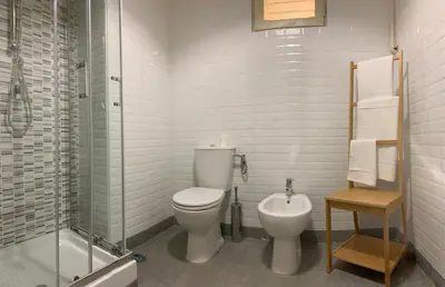 a bathroom with a toilet and a shower and a sink at Colosseo Boutique Apartment in Rome