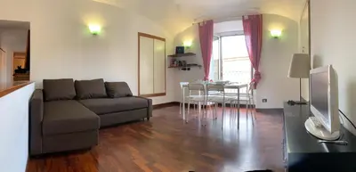 a living room with a couch and a table at Colosseo Boutique Apartment in Rome