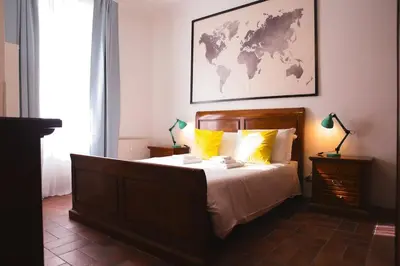 a bedroom with a bed with a map on the wall at St.Peter flat in Rome