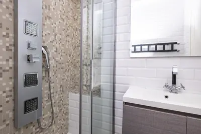 a bathroom with a sink and a shower at Vatican Quiet Apartment with Garden & Parking in Rome