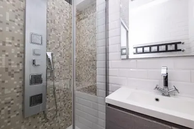 a bathroom with a sink and a shower at Vatican Quiet Apartment with Garden & Parking in Rome