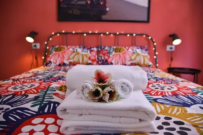 a pile of towels sitting on top of a bed at Vatican Mirò Holidays in Rome