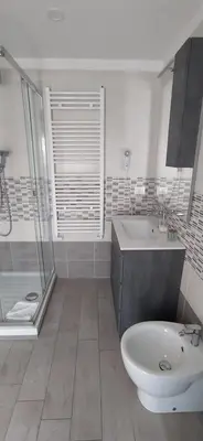 a bathroom with a tub and a sink and a toilet at Pretty Tiburtina Room in Rome