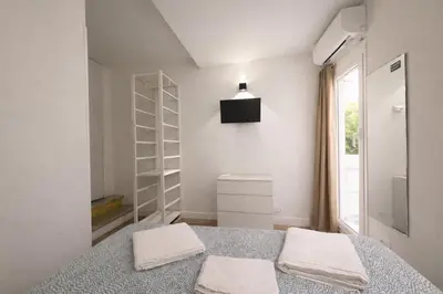 a bedroom with a bed with two towels on it at Pied a Terre Barberini in Rome