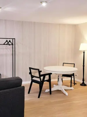 a living room with a table and two chairs at Loft 5c - Palatino in Rome