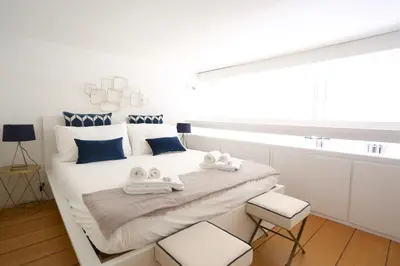 a bedroom with a white bed with towels on it at Loft 5c - Palatino in Rome