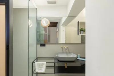 a bathroom with a sink and a mirror at Monti Exclusive Medieval Tower in Rome