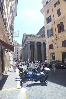a group of motorcycles parked on a city street at Penelope's House in Rome