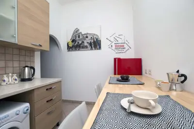 a kitchen with a table with a bowl on it at Il Cortiletto di Via Tuscolana in Rome