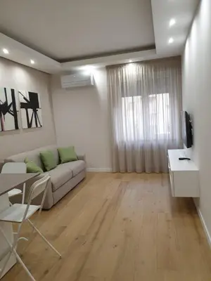 a living room with a couch and a table at T&T Luxury Home Rome int 4 in Rome