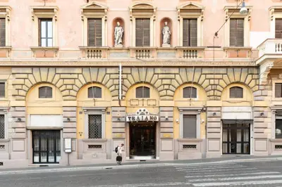 a building with a man standing in front of it at The Great View in Rome