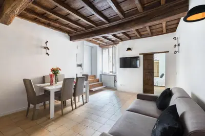 a living room with a couch and a table at A World Aparts - 13 T.Argentina in Rome