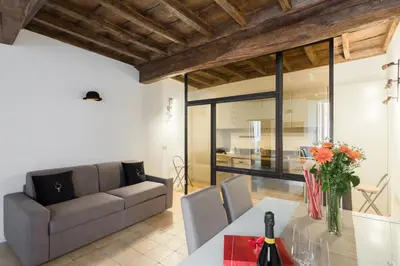 a living room with a couch and a table at A World Aparts - 13 T.Argentina in Rome