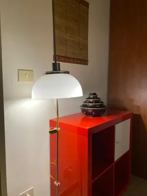 a red cabinet with a lamp on top of it at Suite China Soul - Flaminio - Olimpico - Auditorium in Rome