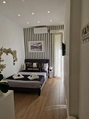 a bedroom with a bed with towels on it at Homey in Rome