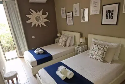 a bedroom with two beds and a window at Homey in Rome