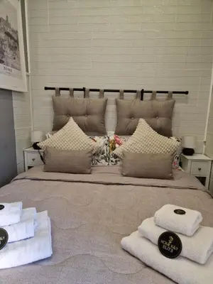 a bedroom with a bed with a room service sign on it at Homey in Rome