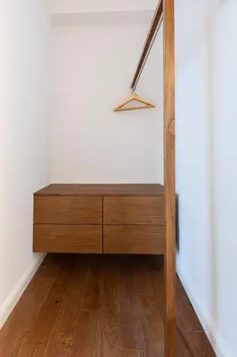 a wooden dresser in the corner of a room at Louly Trevi Fountain in Rome