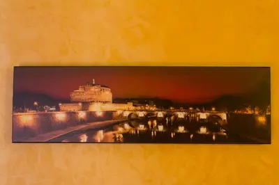 a picture of a building on a wall at Affittacamere Mazzini in Rome