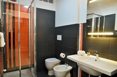 a bathroom with a sink and a toilet and a shower at G&G Trastevere in Rome